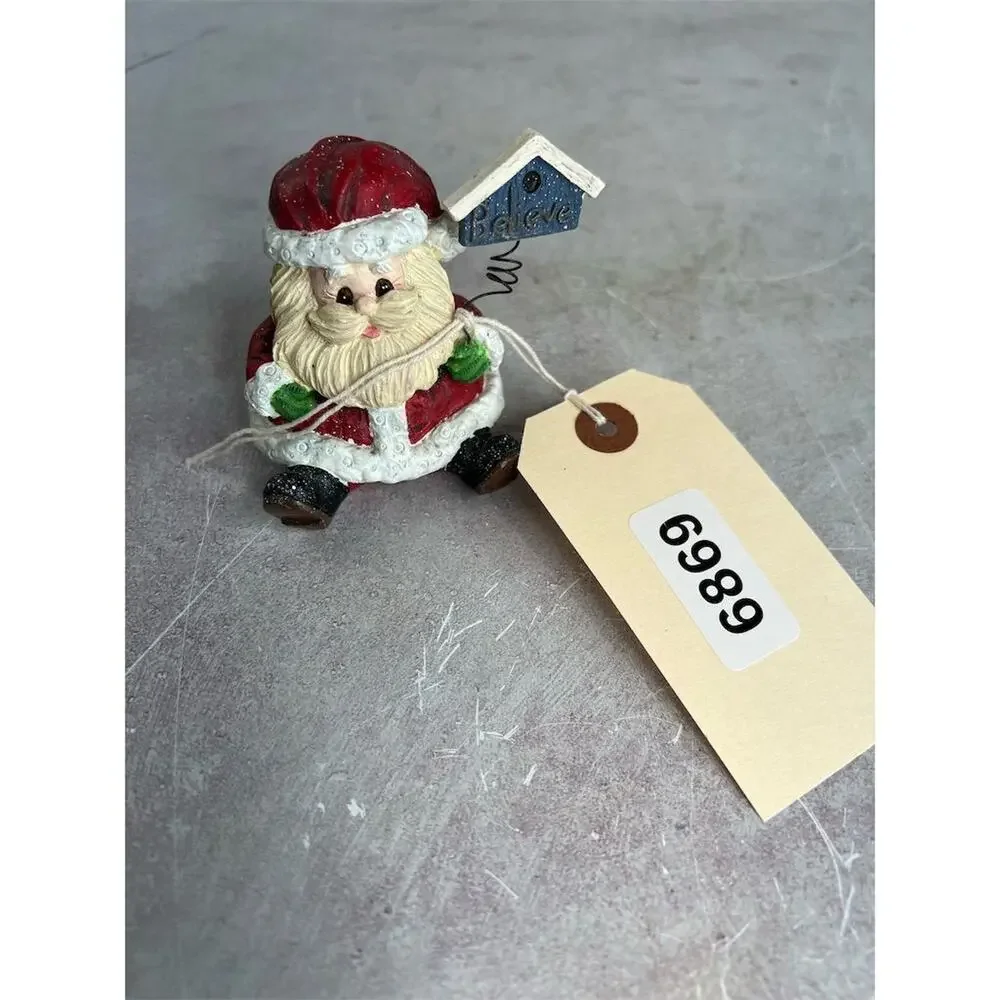 A Berry Merry Christmas Santa Claus Figurine 3